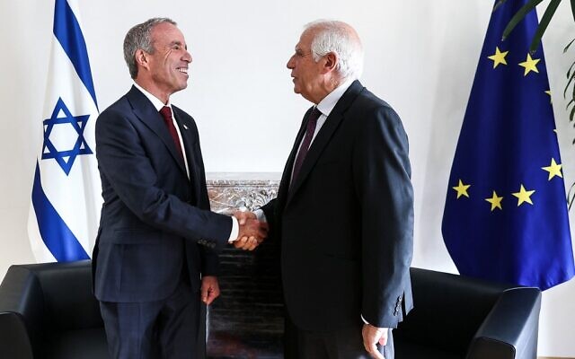 EU foreign policy chief Josep Borrell (R) shakes hands with Intelligence Minister Elazar Stern before an EU-Israel Association Council at the European Council in Brussels, on October 3, 2022. (Kenzo TRIBOUILLARD / AFP) EU foreign policy chief Josep Borrell (R) shakes hands with Intelligence Minister Elazar Stern before an EU-Israel Association Council at the European Council in Brussels, on October 3, 2022. (Kenzo TRIBOUILLARD / AFP)