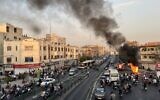 A motorcycle on fire in Iran's capital Tehran, on October 8, 2022. (A picture obtained by AFP outside Iran)