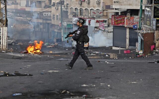 A member of the Israeli security forces is pictured in the Shuafat refugee camp in East Jerusalem, during clashes with Palestinians, on October 12, 2022.  (Ahmad Gharabli/AFP)
