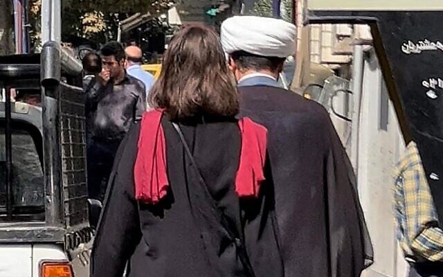 A picture obtained by AFP outside Iran shows a woman walking without a head scarf in the heart of the Iranian capital Tehran, on October 11, 2022. (AFP) A picture obtained by AFP outside Iran shows a woman walking without a head scarf in the heart of the Iranian capital Tehran, on October 11, 2022. (AFP)