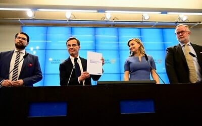 From left to rights: Sweden Democrats leader Jimmie Akesson, Moderate party head Ulf Kristersson, Christian Democrats chief Ebba Busch and Liberal party chair Johan Pehrson attend a press conference on the formation of a coalition government, at the parliament press office in Stockholm, October 14, 2022. (Jonas Ekstromer/Various Sources/AFP)