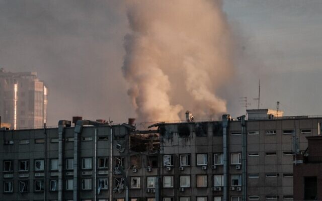 Smoke rises from a partially destroyed building in Kyiv on October 17, 2022, amid the Russian invasion of Ukraine. (Yasuyoshi CHIBA / AFP) Smoke rises from a partially destroyed building in Kyiv on October 17, 2022, amid the Russian invasion of Ukraine. (Yasuyoshi CHIBA / AFP)