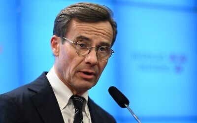 The leader of Sweden's Moderate Party and newly elected prime minister, Ulf Kristersson, holds a press conference after the parliamentary vote to make him premier, at the Riksdagen in the Swedish capital Stockholm, October 17, 2022. (Jonathan Nackstrand/AFP)