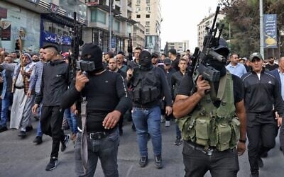 Gunmen at the funeral of those killed in clashes sparked by an overnight Israeli raid against the Lion's Den terror group, in the West Bank city of Nablus on October 25, 2022. (Ronaldo Schemidt/AFP)