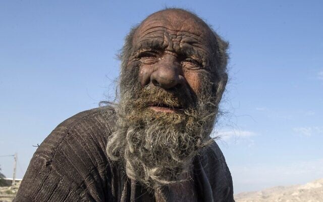 In this file photo taken on December 28, 2018, Amou Haji (uncle Haji) sits on the outskirts of the village of Dezhgah in the Dehram district of the southwestern Iranian Fars province. (AFP) In this file photo taken on December 28, 2018, Amou Haji (uncle Haji) sits on the outskirts of the village of Dezhgah in the Dehram district of the southwestern Iranian Fars province. (AFP)