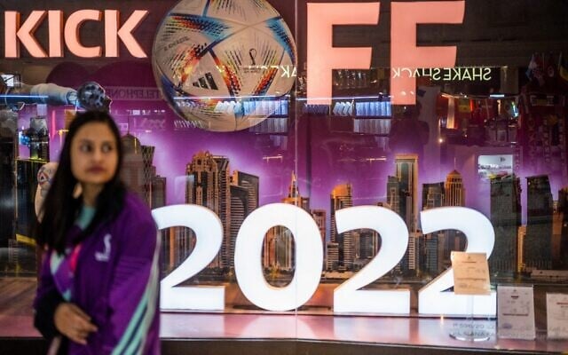 A woman walks past a store in a mall in Doha on October 29, 2022, ahead of the Qatar 2022 FIFA World Cup football tournament. (Photo by Jewel SAMAD / AFP) A woman walks past a store in a mall in Doha on October 29, 2022, ahead of the Qatar 2022 FIFA World Cup football tournament. (Photo by Jewel SAMAD / AFP)