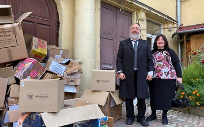 Rabbi Mordechai Bald and his wife, Sara, have distributed thousands of boxes of supplies to Jewish refugees from around Ukraine in Lviv – boxes of empty products that they have given out lie around outside the synagogue. (Jacob Judah/ JTA)