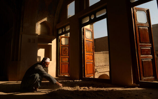 An Afghan worker reconstructs part of the Yu Aw synagogue in Herat, Afghanistan. (AFP/Getty via JTA) An Afghan worker reconstructs part of the Yu Aw synagogue in Herat, Afghanistan. (AFP/Getty via JTA)