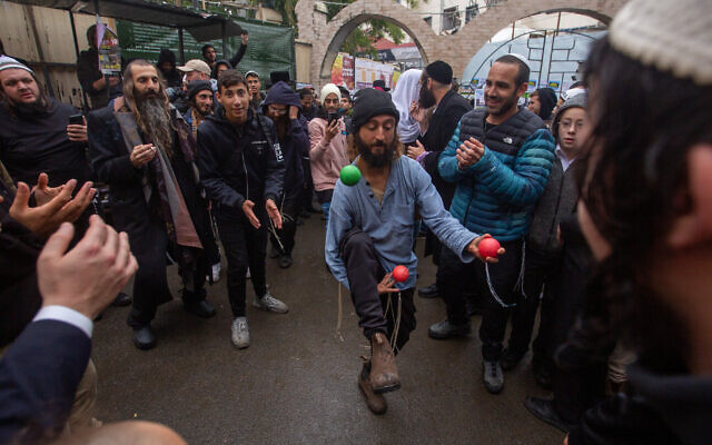 A scene from the Jewish celebration in the street in Uman, September 25, 2022. (David Saveliev/ JTA) A scene from the Jewish celebration in the street in Uman, September 25, 2022. (David Saveliev/ JTA)