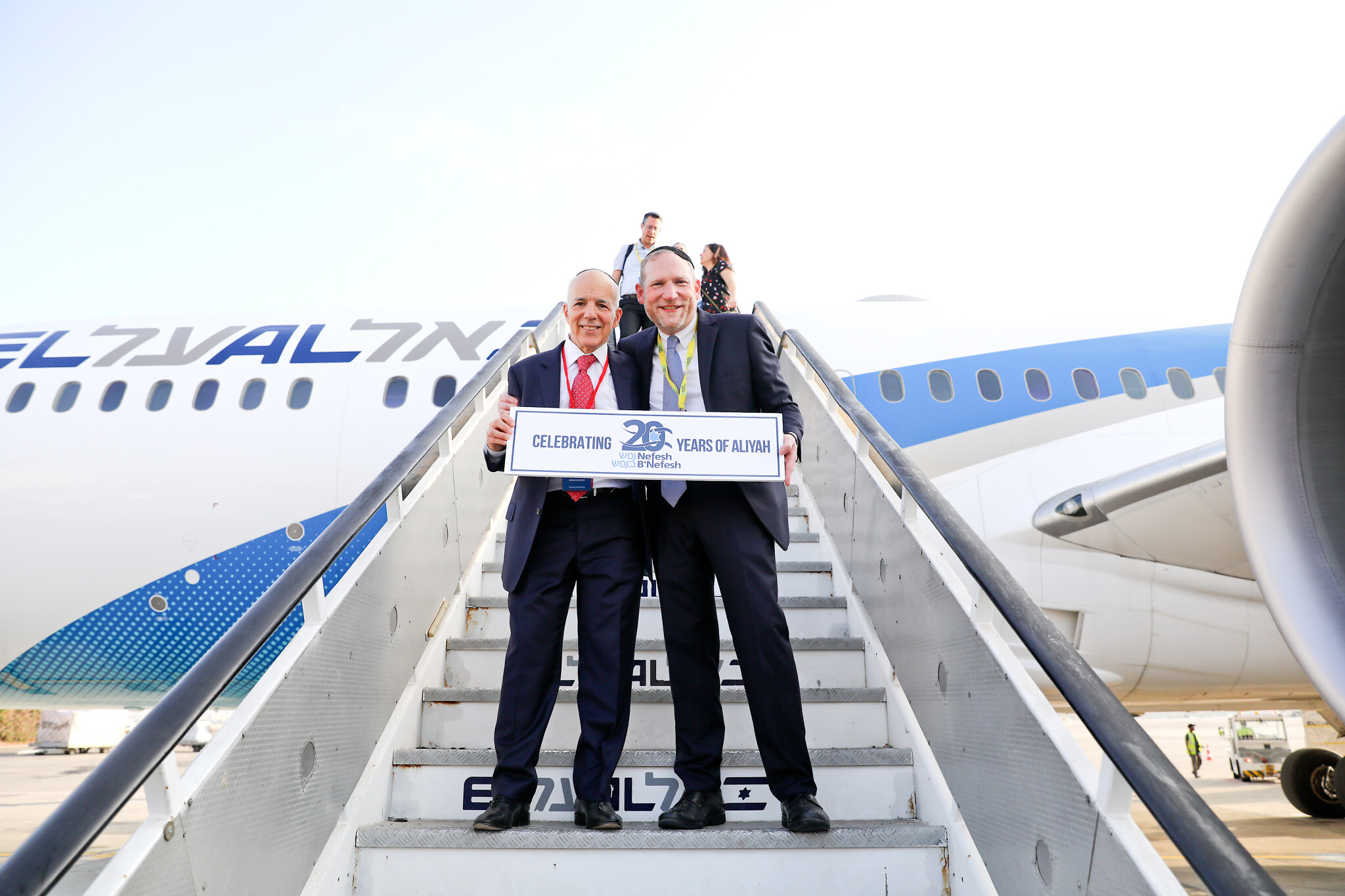 (2022Charter) – Co-Founders of NBN, Tony Gelbart and Rabbi Yehoshua Fass, de-plane 63rd charter Aliyah flight and celebrate 20 years of the organization (Photo credit: Yonit Schiller) (2022Charter) – Co-Founders of NBN, Tony Gelbart and Rabbi Yehoshua Fass, de-plane 63rd charter Aliyah flight and celebrate 20 years of the organization (Photo credit: Yonit Schiller)