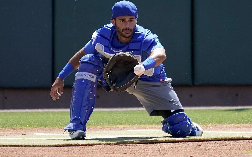 Israel Olympic baseball player Tal Erel fields a ball at Salt River Fields spring training facility, Wednesday, May 12, 2021, in Scottsdale, Arizona (AP Photo/Matt York)