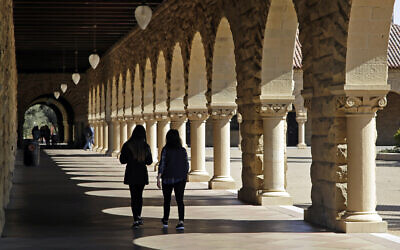 Students walk on the Stanford University campus in Stanford, Califorbua, March 14, 2019. (AP Photo/Ben Margot)