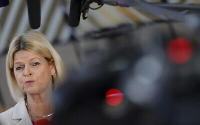 Austrian defense minister Klaudia Tanner talks to the press prior to the EU foreign and defense ministers council at the Europa building in Brussels, March 21, 2022. (Olivier Matthys/AP)