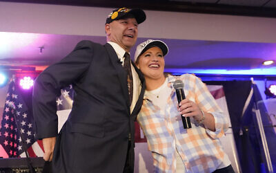 State Sen. Doug Mastriano, a Republican candidate for Governor of Pennsylvania, stands on stage with Jenna Ellis at a primary night election gathering in Chambersburg, Pennsylvania, May 17, 2022. (AP Photo/Carolyn Kaster)