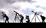 Illustrative -- Astronomers prepare their telescopes, Aug. 10, 1999 near Truro, England  (AP Photo/Dave Caulkin, File)
