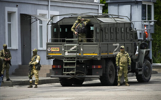 Russian soldiers guard an area as a group of foreign journalists visit in Kherson, Kherson region, south Ukraine, May 20, 2022. (AP Photo, File) Russian soldiers guard an area as a group of foreign journalists visit in Kherson, Kherson region, south Ukraine, May 20, 2022. (AP Photo, File)