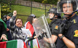 Illustrative: Policemen stand guard as demonstrators gather outside Iran's embassy in Oslo, Norway, Thursday, Sept. 29, 2022, to protest the death of 22-year-old Mahsa Amini in custody in Iran after she was detained by the country’s morality police.(Terje Pedersen/NTB Scanpix via AP)