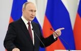 Russian President Vladimir Putin gestures during a ceremony to sign the treaties for four regions of Ukraine to join Russia, at the Kremlin in Moscow, Russia on Sept. 30, 2022. (Mikhail Metzel, Sputnik, Kremlin Pool Photo via AP)