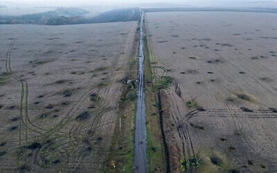 Artillery craters are seen in the field from an aerial view in the recently liberated area of Kharkiv region, Ukraine, September 30, 2022. (AP/Evgeniy Maloletka)
