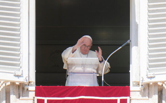 Pope Francis waves during the Angelus noon prayer from the window of his studio overlooking St. Peter's Square, at the Vatican, October 2, 2022. (AP Photo/Alessandra Tarantino) Pope Francis waves during the Angelus noon prayer from the window of his studio overlooking St. Peter's Square, at the Vatican, October 2, 2022. (AP Photo/Alessandra Tarantino)