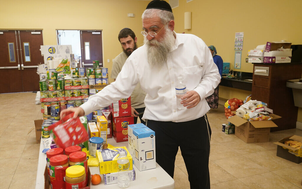 Rabbi Yitzchok Minkowicz supervises the pantry inside the Chabad Lubavitch of Southwest Florida, Monday, October 3, 2022, in Fort Myers, Fla. (AP Photo/Marta Lavandier) Rabbi Yitzchok Minkowicz supervises the pantry inside the Chabad Lubavitch of Southwest Florida, Monday, October 3, 2022, in Fort Myers, Fla. (AP Photo/Marta Lavandier)