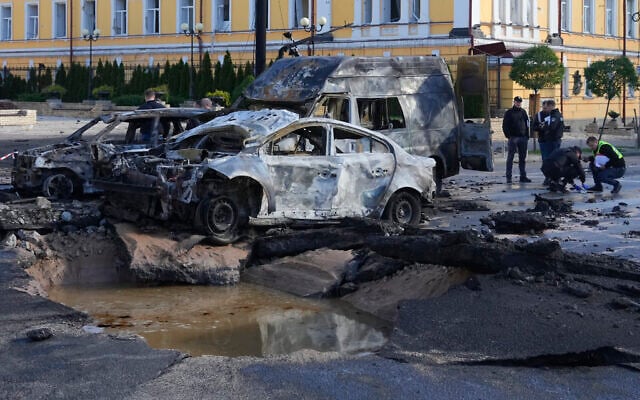 Damaged cars are seen at the scene of Russian shelling, in Kyiv, Ukraine, October 10, 2022. (AP Photo/Efrem Lukatsky) Damaged cars are seen at the scene of Russian shelling, in Kyiv, Ukraine, October 10, 2022. (AP Photo/Efrem Lukatsky)