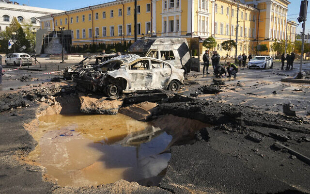 Police inspect the scene of Russian strikes on Kyiv, Ukraine, October 10, 2022. (AP Photo/Efrem Lukatsky)