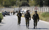 Israeli soldiers near the site where a soldier was killed by gunfire near the West Bank settlement of Shavei Shomron, Oct. 11, 2022. (AP Photo/Majdi Mohammed, file)