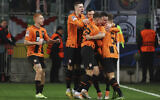 Shakhtar's team players celebrate after scoring the opening goal during the Champions League group F soccer match between Shakhtar Donetsk and Real Madrid at Polish Army Stadium stadium in Warsaw, Poland, October 11, 2022. (AP Photo/Michal Dyjuk)