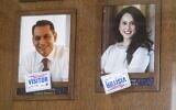 Stickers are placed on the pictures of Los Angeles Council members Gil Cedillo, left, and Nury Martinez near the entrance of the John Ferraro Council Chamber Wednesday, Oct. 12, 2022, in Los Angeles (AP Photo/Ringo H.W. Chiu, File)