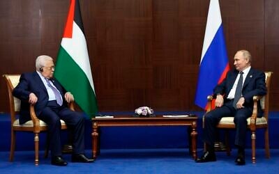 Russian President Vladimir Putin, right, and Palestinian Authority President Mahmoud Abbas meet on the sidelines of the Conference on Interaction and Confidence Building Measures in Asia (CICA) summit, in Astana, Kazakhstan, October 13, 2022. (Vyacheslav Prokofyev/Sputnik, Kremlin Pool Photo via AP)