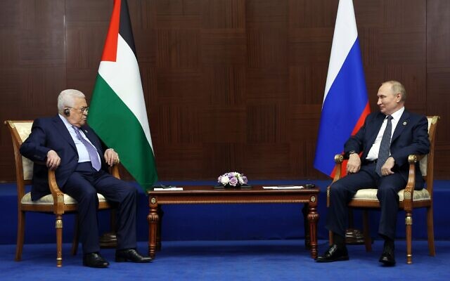 Russian President Vladimir Putin, right, and Palestinian Authority President Mahmoud Abbas meet on the sidelines of the Conference on Interaction and Confidence Building Measures in Asia (CICA) summit, in Astana, Kazakhstan, October 13, 2022. (Vyacheslav Prokofyev/Sputnik, Kremlin Pool Photo via AP)