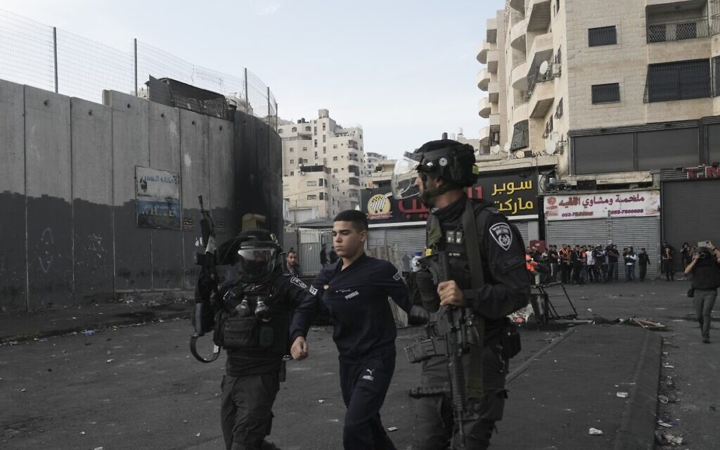 Israeli police arrest a Palestinian during clashes in Shuafat refugee camp in East Jerusalem, Wednesday, Oct.12. 2022 (AP Photo/Mahmoud Illean, File) Israeli police arrest a Palestinian during clashes in Shuafat refugee camp in East Jerusalem, Wednesday, Oct.12. 2022 (AP Photo/Mahmoud Illean, File)