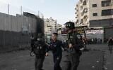 Israeli police arrest a Palestinian during clashes in Shuafat refugee camp in East Jerusalem, Wednesday, Oct.12. 2022 (AP Photo/Mahmoud Illean, File)