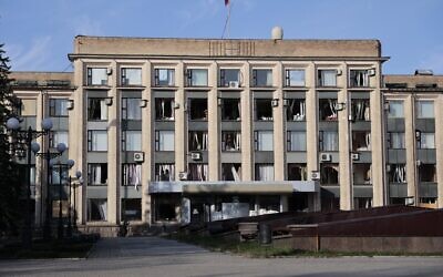 A view of a damaged administrative building after a missile attack in Donetsk, the capital of Donetsk People's Republic, eastern in Ukraine, October 16, 2022. (AP/Alexei Alexandrov)