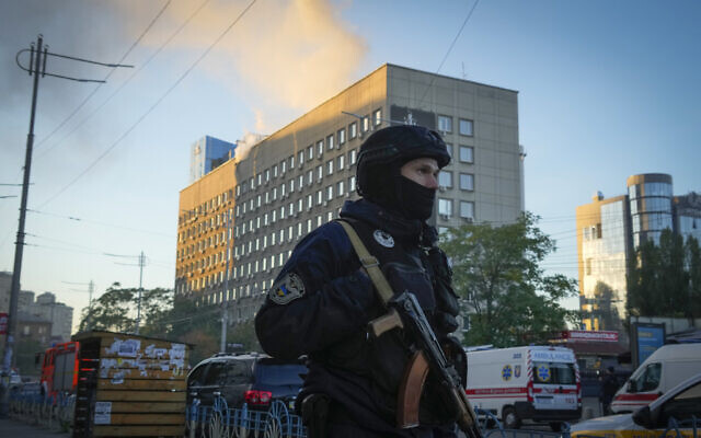 Police block the perimeter at the scene of Russian shelling in Kyiv, Ukraine, Oct. 17, 2022, after some explosions rocked Kyiv in the early morning. (AP Photo/Efrem Lukatsky)