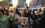 Iranian women shout slogans to protest over the death of Mahsa Amini during a demonstration outside the Iranian consulate in Istanbul, Turkey, October 17, 2022. (AP Photo/Emrah Gurel)