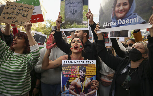 Iranian women shout slogans to protest over the death of Mahsa Amini during a demonstration outside the Iranian consulate in Istanbul, Turkey, October 17, 2022. (AP Photo/Emrah Gurel) Iranian women shout slogans to protest over the death of Mahsa Amini during a demonstration outside the Iranian consulate in Istanbul, Turkey, October 17, 2022. (AP Photo/Emrah Gurel)