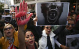 Iranian women shout slogans to protest over the death of Mahsa Amini during a demonstration outside the Iranian consulate in Istanbul, Turkey, October 17, 2022. (AP Photo/Emrah Gurel)