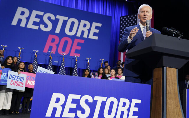 US President Joe Biden speaks about abortion access during a Democratic National Committee event at the Howard Theatre, in Washington, October 18, 2022. (Evan Vucci/AP) US President Joe Biden speaks about abortion access during a Democratic National Committee event at the Howard Theatre, in Washington, October 18, 2022. (Evan Vucci/AP)