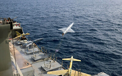 In this photo released by the Iranian Army on Aug. 25, 2022, a drone is launched from a warship in a military drone drill in Iran. (Iranian Army via AP)