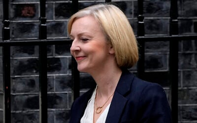 Britain's Prime Minister Liz Truss leaves 10 Downing Street to attend the weekly Prime Ministers' Questions session in parliament in London, October 19, 2022. (Kin Cheung/AP)
