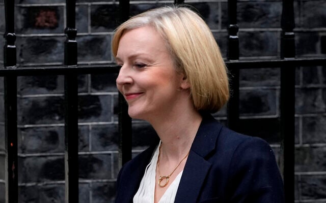 Britain's Prime Minister Liz Truss leaves 10 Downing Street to attend the weekly Prime Ministers' Questions session in parliament in London, October 19, 2022. (Kin Cheung/AP) Britain's Prime Minister Liz Truss leaves 10 Downing Street to attend the weekly Prime Ministers' Questions session in parliament in London, October 19, 2022. (Kin Cheung/AP)