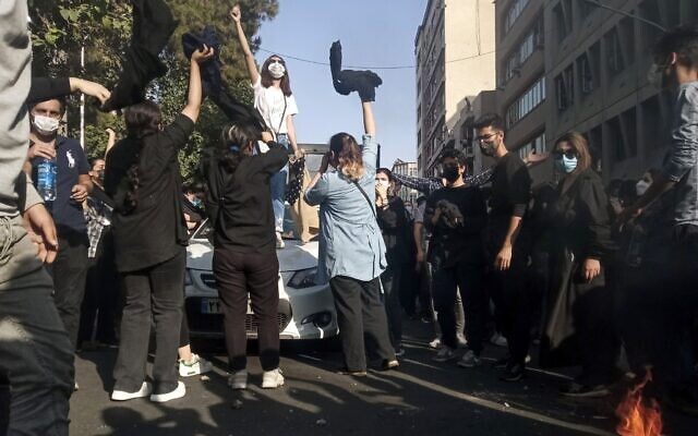 Iranians protest the death of Mahsa Amini after she was detained by the morality police, in Tehran, October 1, 2022. (Photo taken by an individual not employed by the Associated Press and obtained by the AP outside Iran/ Middle East Images) Iranians protest the death of Mahsa Amini after she was detained by the morality police, in Tehran, October 1, 2022. (Photo taken by an individual not employed by the Associated Press and obtained by the AP outside Iran/ Middle East Images)