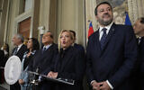 Brothers of Italy's leader Giorgia Meloni is flanked by The League leader Matteo Salvini, right, Forza Italia president Silvio Berlusconi, Senator Licia Ronzulli and Antonio Tajani as she talks to the press at the Quirinale Presidential Palace after a meeting with Italian President Sergio Mattarella as part of a round of consultations with party leaders to try and form a new government, in Rome, Oct. 21, 2022. (AP Photo/Gregorio Borgia)