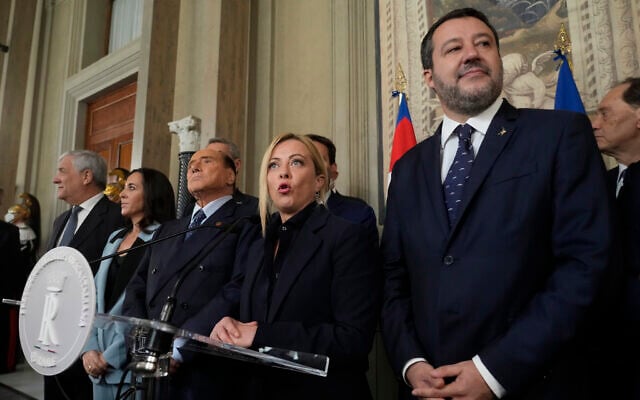 Brothers of Italy's leader Giorgia Meloni is flanked by The League leader Matteo Salvini, right, Forza Italia president Silvio Berlusconi, Senator Licia Ronzulli and Antonio Tajani as she talks to the press at the Quirinale Presidential Palace after a meeting with Italian President Sergio Mattarella as part of a round of consultations with party leaders to try and form a new government, in Rome, Oct. 21, 2022. (AP Photo/Gregorio Borgia) Brothers of Italy's leader Giorgia Meloni is flanked by The League leader Matteo Salvini, right, Forza Italia president Silvio Berlusconi, Senator Licia Ronzulli and Antonio Tajani as she talks to the press at the Quirinale Presidential Palace after a meeting with Italian President Sergio Mattarella as part of a round of consultations with party leaders to try and form a new government, in Rome, Oct. 21, 2022. (AP Photo/Gregorio Borgia)