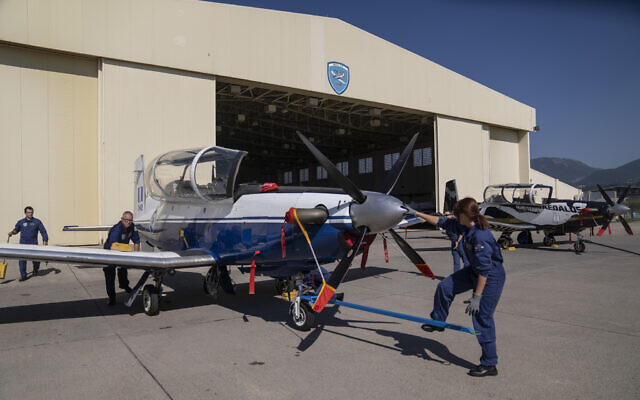 Greek air force maintenance staff park a T-6 single-engine turboprop training aircraft at an airbase outside the southern port city of Kalamata, Greece, October 21, 2022. (AP/Petros Giannakouris) Greek air force maintenance staff park a T-6 single-engine turboprop training aircraft at an airbase outside the southern port city of Kalamata, Greece, October 21, 2022. (AP/Petros Giannakouris)