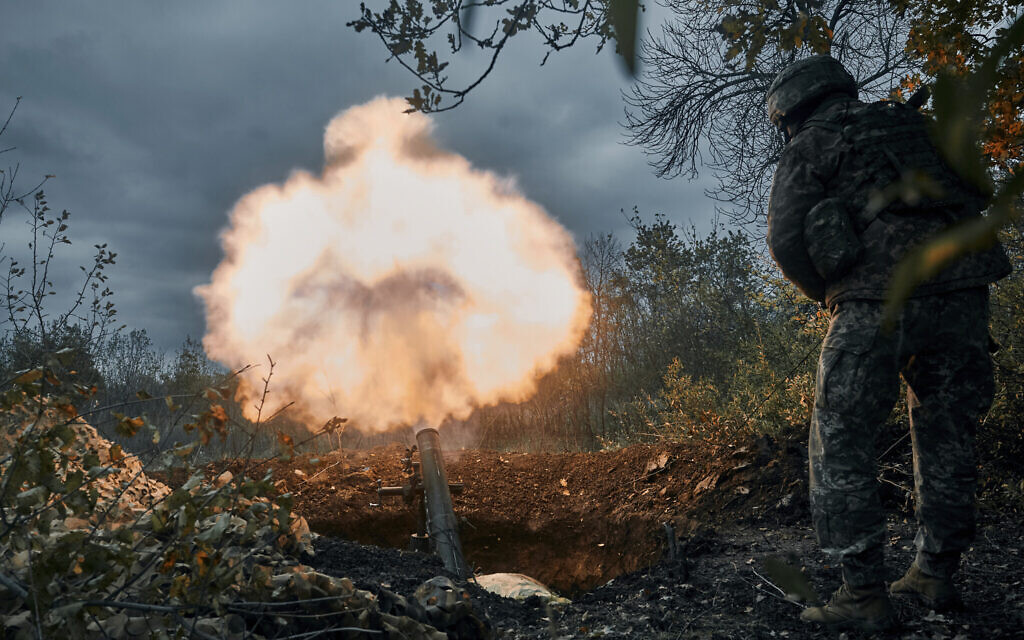 Ukrainian soldiers fire at Russian positions with a mortar in Bakhmut, Donetsk region, Ukraine, October 21, 2022. (AP Photo/LIBKOS) Ukrainian soldiers fire at Russian positions with a mortar in Bakhmut, Donetsk region, Ukraine, October 21, 2022. (AP Photo/LIBKOS)