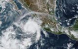 This satellite image taken at 15:30 UTC and provided by NOAA shows Hurricane Roslyn approaching the Pacific coast of Mexico, October 22, 2022. (NOAA via AP)