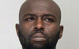 This undated booking photo provided by the Dallas County Sheriff's Office shows Henry "Michael" Dwight Williams. (Dallas County Sheriff's Office via AP)
